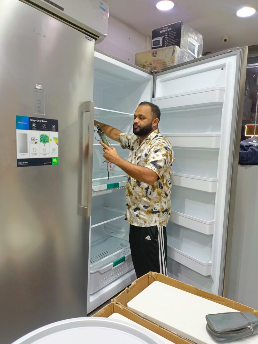 Servicing an upright inverter fridge in Jeddah