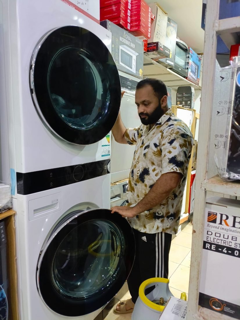 Servicing a washer-dryer tower in Jeddah